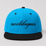 Noctilupus Snapback Cap in Aqua Blue and Black